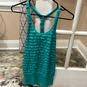 Teal blue halter with a ruffled center.